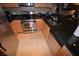 Efficient kitchen layout featuring stainless steel appliances, light wood cabinets, and tile floors at 270 E Flamingo Rd # 319, Las Vegas, NV 89169