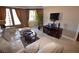 A spacious living room with natural light, stylish furniture, and a modern entertainment center at 270 E Flamingo Rd # 319, Las Vegas, NV 89169