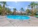 Community pool with palm trees and a building in the background, creating a resort-like ambiance at 270 E Flamingo Rd # 319, Las Vegas, NV 89169