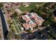 Aerial view shows a community recreation center featuring bocce ball courts and covered seating areas at 2816 Golfside Dr, Las Vegas, NV 89134