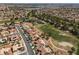 Scenic aerial of a golf course community with ponds and homes surrounded by mature trees and lush landscaping at 2816 Golfside Dr, Las Vegas, NV 89134