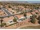 Wide aerial view of the property in a neighborhood setting near lush green landscape at 2816 Golfside Dr, Las Vegas, NV 89134
