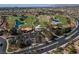 A panoramic aerial shot showcases a golf course community featuring lush fairways, serene ponds, and manicured landscaping at 2816 Golfside Dr, Las Vegas, NV 89134
