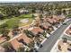 Aerial view of a well-maintained community with golf course access and mature landscaping throughout the neighborhood at 2816 Golfside Dr, Las Vegas, NV 89134