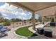 Relaxing covered patio with comfortable seating and beautiful views of the lush golf course at 2816 Golfside Dr, Las Vegas, NV 89134
