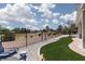 Beautifully landscaped backyard with turf and neutral stone; overlooks verdant golf course at 2816 Golfside Dr, Las Vegas, NV 89134