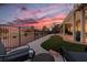 Backyard turf and neutral stone meet dusk skies; overlooking the verdant golf course at 2816 Golfside Dr, Las Vegas, NV 89134