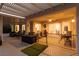 Tranquil covered patio with seating, grill, and well-lit ambiance at 2816 Golfside Dr, Las Vegas, NV 89134