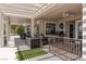 Relaxing covered patio with a grill, seating area, and golf course views at 2816 Golfside Dr, Las Vegas, NV 89134