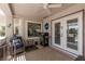Cozy covered patio with comfortable furniture, grill, and peaceful views at 2816 Golfside Dr, Las Vegas, NV 89134