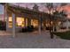 Exterior evening view showcases a well-manicured backyard with neutral rock at 2816 Golfside Dr, Las Vegas, NV 89134