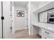 Bright hallway featuring a built-in desk and shelving area with neutral flooring at 2816 Golfside Dr, Las Vegas, NV 89134
