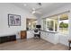 Bright home office featuring custom built-ins, hardwood floors, and views to the outdoors at 2816 Golfside Dr, Las Vegas, NV 89134