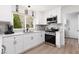 Modern kitchen with stainless steel appliances, white cabinets, and natural light at 2816 Golfside Dr, Las Vegas, NV 89134