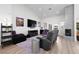 Cozy living room with hardwood floors, recessed lighting, and a tiled fireplace at 2816 Golfside Dr, Las Vegas, NV 89134