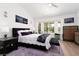 Tranquil main bedroom suite with bay windows and stylish furnishings at 2816 Golfside Dr, Las Vegas, NV 89134