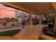 Twilight patio with comfortable seating and meticulously manicured backyard at 2816 Golfside Dr, Las Vegas, NV 89134
