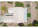 Birds-eye view of a house showcasing its unique roof design and backyard landscaping at 2816 High Range Dr, Las Vegas, NV 89134