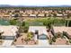 Aerial view of a home with a manicured lawn, golf course views, and mature trees at 2816 High Range Dr, Las Vegas, NV 89134