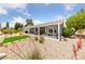 A backyard featuring desert landscaping, artificial turf, a covered patio, and ample seating at 2816 High Range Dr, Las Vegas, NV 89134