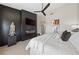 Bright bedroom featuring a wood accent wall with fireplace and decorative statue at 2816 High Range Dr, Las Vegas, NV 89134