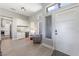 Light and bright entry with modern door, adjacent bar area and partial view into kitchen at 2816 High Range Dr, Las Vegas, NV 89134