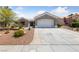 Charming single-story house featuring a two-car garage and well-maintained desert landscaping at 2816 High Range Dr, Las Vegas, NV 89134