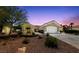 Charming single-story home featuring a well-manicured front yard, neutral paint, and an attached two-car garage at 2816 High Range Dr, Las Vegas, NV 89134