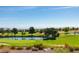 Scenic view of the golf course featuring lush greens, serene ponds, and distant mountain views at 2816 High Range Dr, Las Vegas, NV 89134