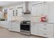 Modern kitchen with stainless appliances and white cabinetry at 2816 High Range Dr, Las Vegas, NV 89134