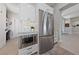 Bright kitchen featuring stainless steel appliances, white cabinets, and an open layout at 2816 High Range Dr, Las Vegas, NV 89134