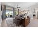 This bright living room is open to the kitchen and outside patio at 2816 High Range Dr, Las Vegas, NV 89134