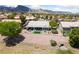 Backyard featuring an outdoor living space, desert landscaping, and a mountain view at 2816 High Range Dr, Las Vegas, NV 89134