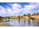 Scenic view of the lake in the community, showcasing lush landscaping and beautiful homes at 2816 High Range Dr, Las Vegas, NV 89134