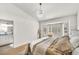 Bright bedroom boasts a bay window, plantation shutters, and plush bedding at 3009 Anna Bay Dr, Las Vegas, NV 89134