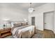 Spacious bedroom featuring a chandelier, plush bedding, and wood-style flooring at 3009 Anna Bay Dr, Las Vegas, NV 89134