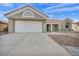 Charming single-story home features a well-maintained front yard and two car garage at 3009 Anna Bay Dr, Las Vegas, NV 89134