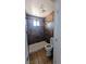 Bathroom with tiled shower, window, modern toilet and exhaust fan at 3020 Wilmington Way, Las Vegas, NV 89102