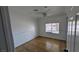Empty bedroom with tile floors and natural light through window at 3020 Wilmington Way, Las Vegas, NV 89102
