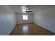 Spacious bedroom with natural light, ceiling fan, neutral color palette and tile flooring creates inviting atmosphere at 3020 Wilmington Way, Las Vegas, NV 89102