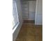 Bedroom closet featuring shelving and closet rod for optimal storage space with tile floor and natural light from window at 3020 Wilmington Way, Las Vegas, NV 89102