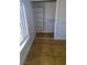 Bedroom closet featuring shelving and closet rod for optimal storage space with tile floor and natural light from window at 3020 Wilmington Way, Las Vegas, NV 89102