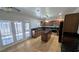 Bright kitchen includes center island, tile floors and stainless steel appliances at 3020 Wilmington Way, Las Vegas, NV 89102