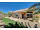 Exterior view highlighting the backyard with stone path, artificial grass, and home's architecture at 3112 Haddon Dr, Las Vegas, NV 89134