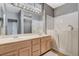 A well-lit bathroom features a walk-in tub, double sink vanity, and large mirror at 3112 Haddon Dr, Las Vegas, NV 89134