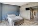 Comfortable bedroom with wood-look flooring, soft lighting, and a neutral color palette at 3112 Haddon Dr, Las Vegas, NV 89134