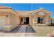 Charming home entrance featuring a brick walkway and manicured landscaping at 3112 Haddon Dr, Las Vegas, NV 89134