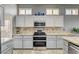 This kitchen showcases light gray cabinets, granite countertops, and stainless steel appliances at 3112 Haddon Dr, Las Vegas, NV 89134