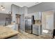 Well-equipped kitchen with granite countertops and stainless steel refrigerator at 3112 Haddon Dr, Las Vegas, NV 89134