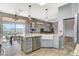 Well-appointed kitchen with stainless appliances, farmhouse sink, and backyard views at 3112 Haddon Dr, Las Vegas, NV 89134